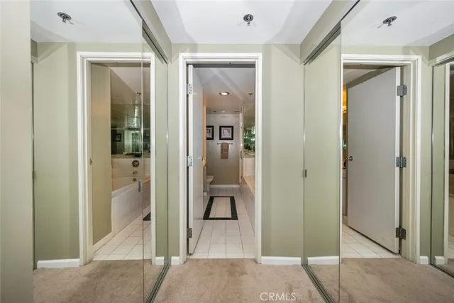 a bedroom with a bed and a desk