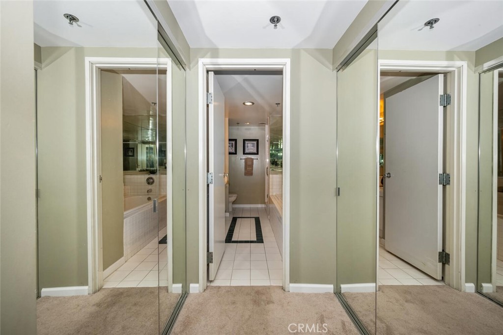 525 East Seaside Way, Unit 904 Long Beach, CA 90802 - Photo 24 of 58 a view of a hallway with wooden floor and living room