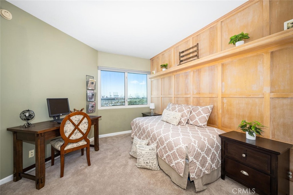 525 East Seaside Way, Unit 904 Long Beach, CA 90802 - Photo 27 of 58 a bed room with a bed and a chair