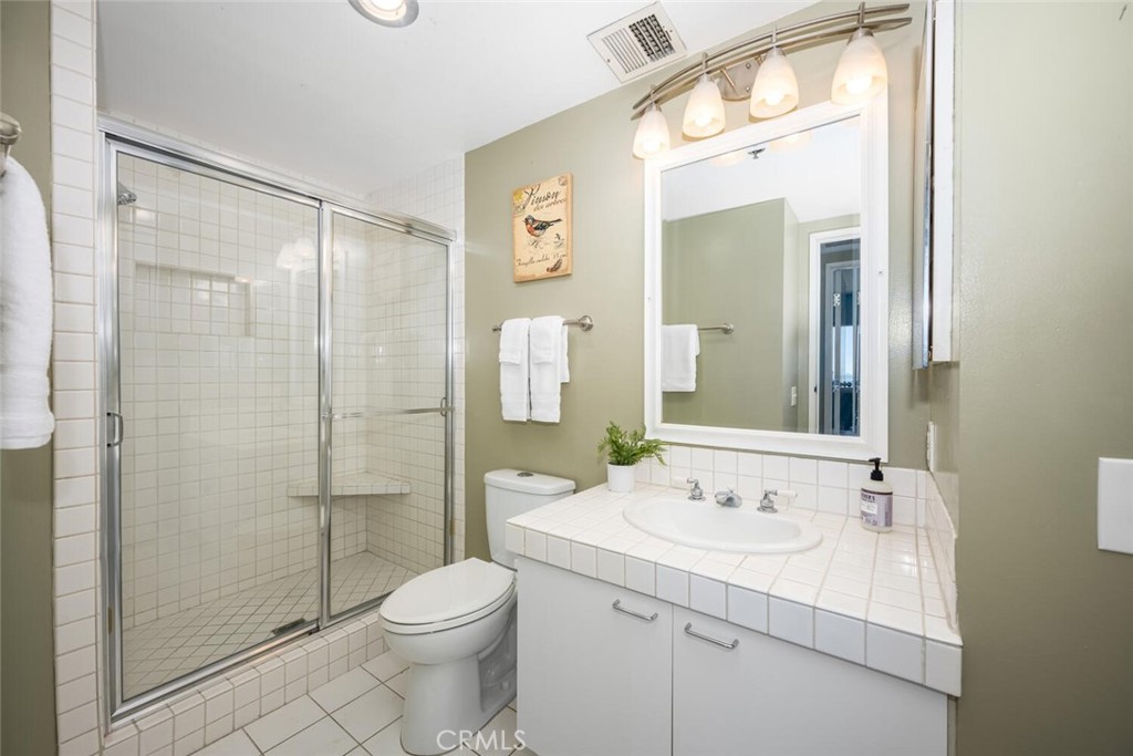 525 East Seaside Way, Unit 904 Long Beach, CA 90802 - Photo 30 of 58 a bathroom with a sink a toilet and shower