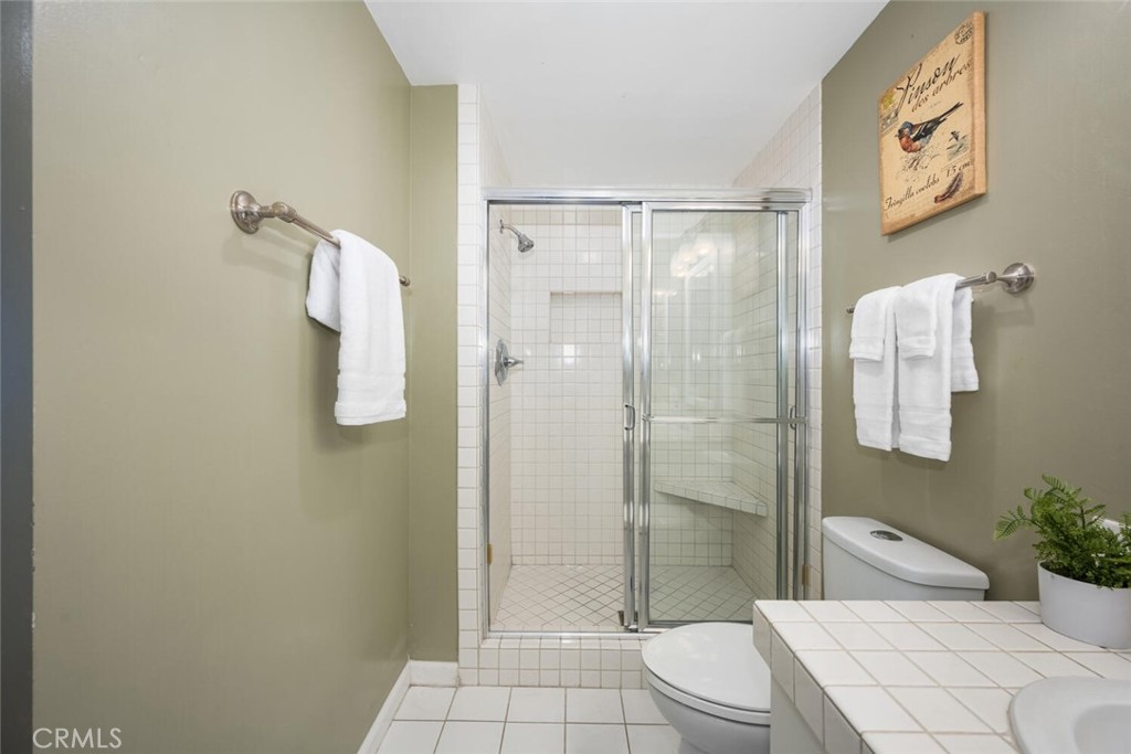 525 East Seaside Way, Unit 904 Long Beach, CA 90802 - Photo 31 of 58 a bathroom with a granite countertop sink toilet and shower