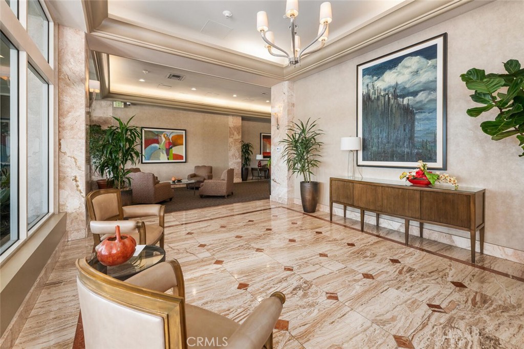 525 East Seaside Way, Unit 904 Long Beach, CA 90802 - Photo 46 of 58 a living room with furniture and a chandelier