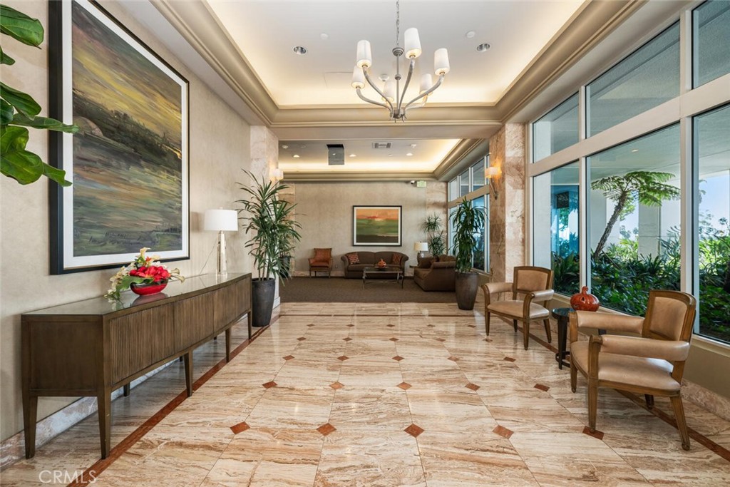 525 East Seaside Way, Unit 904 Long Beach, CA 90802 - Photo 47 of 58 a living room with furniture and a chandelier