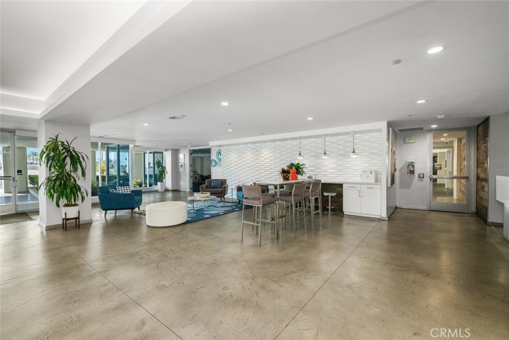 525 East Seaside Way, Unit 904 Long Beach, CA 90802 - Photo 48 of 58 a view of a dining area with furniture and a chandelier