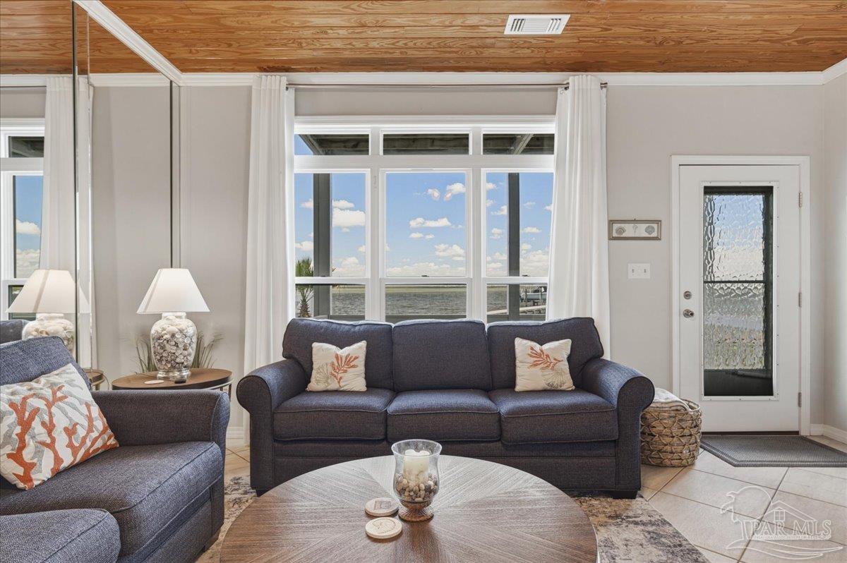 26063 Canal Road, Unit 3F Orange Beach, AL 36561 - Photo 22 of 72 a living room with furniture and a large window