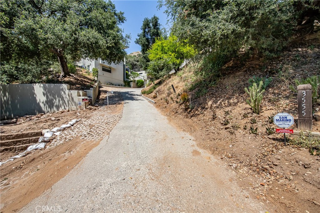3597 Shaw Ranch Road Pasadena, CA 91107 - Photo 23 of 30 a view of a backyard with a large tree