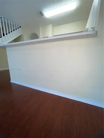a stove top oven sitting inside of a kitchen