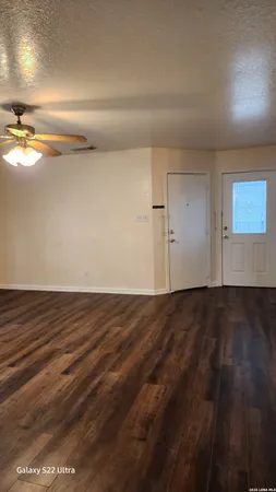 an empty room with wooden floor