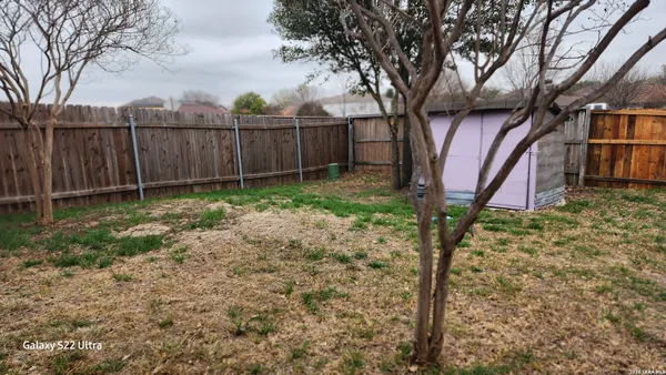 a backyard of a house with lots of green space
