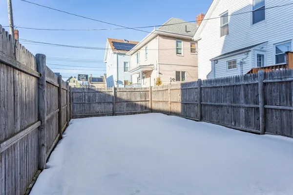 a view of a wrought iron fences in front of house