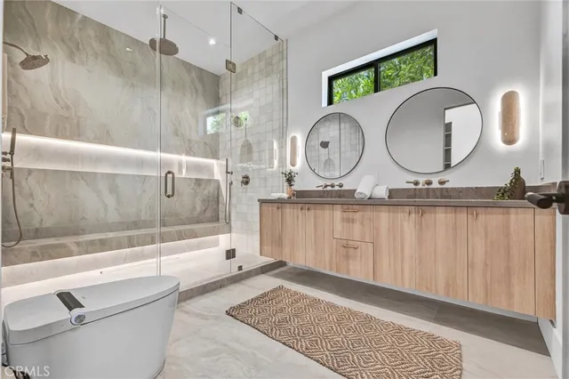 a bathroom with a granite countertop sink mirror vanity and bathtub