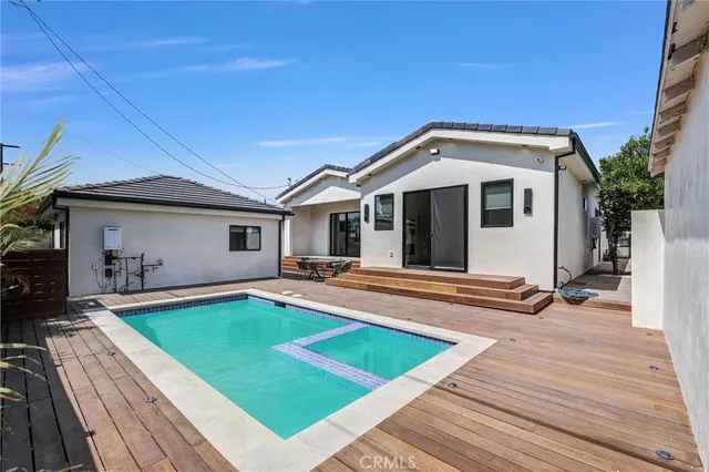 a front view of a house with a yard patio and a slide