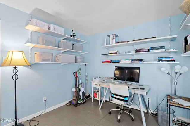 a view of a workspace with furniture