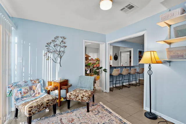 a bedroom with furniture and a lamp