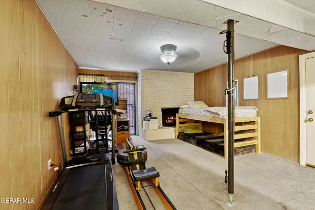 a bedroom with furniture and a window