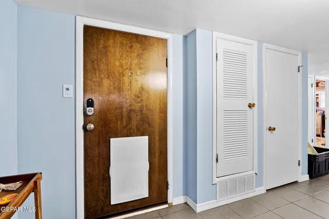 a view of front door with wooden floor