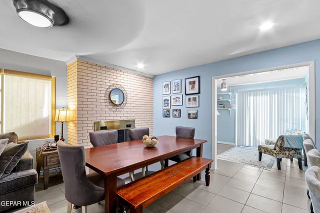 a living room with furniture a large window and a bookshelf