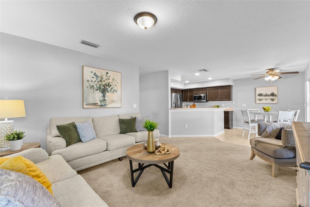 1422 Trail Boss Lane Brandon, FL 33511 - Photo 8 of 31 a living room with furniture and kitchen view