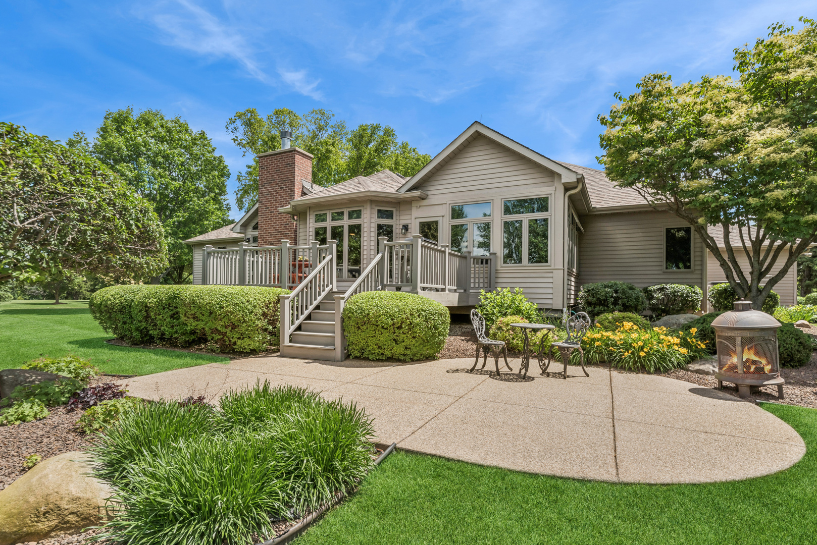 10907 Red Hawk Lane Spring Grove, IL 60071 - Photo 31 of 44 a front view of a house with a garden and plants