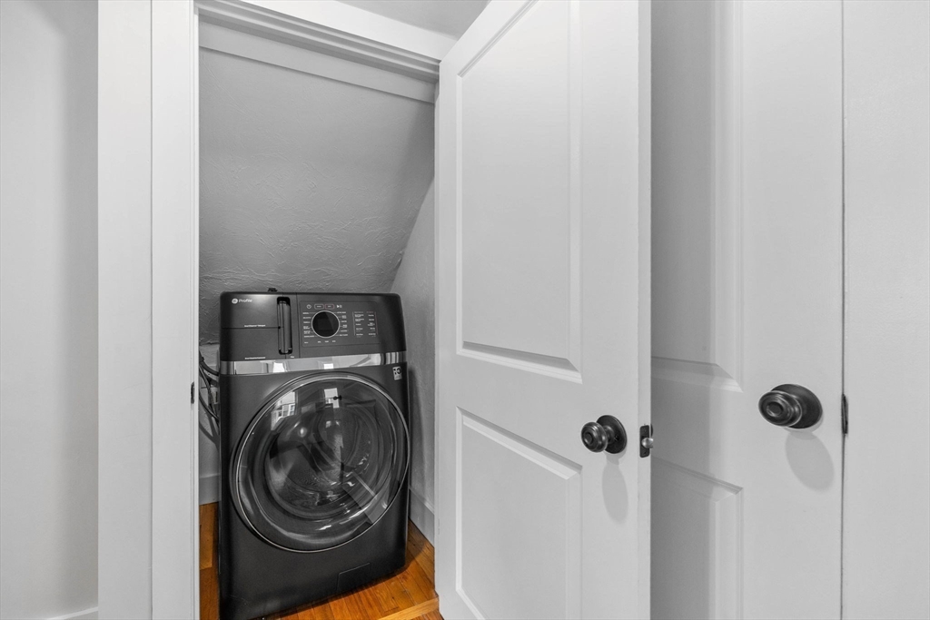 170 Calumet Street, Unit 1 Boston, MA 02120 - Photo 11 of 21 a utility room with dryer and washer