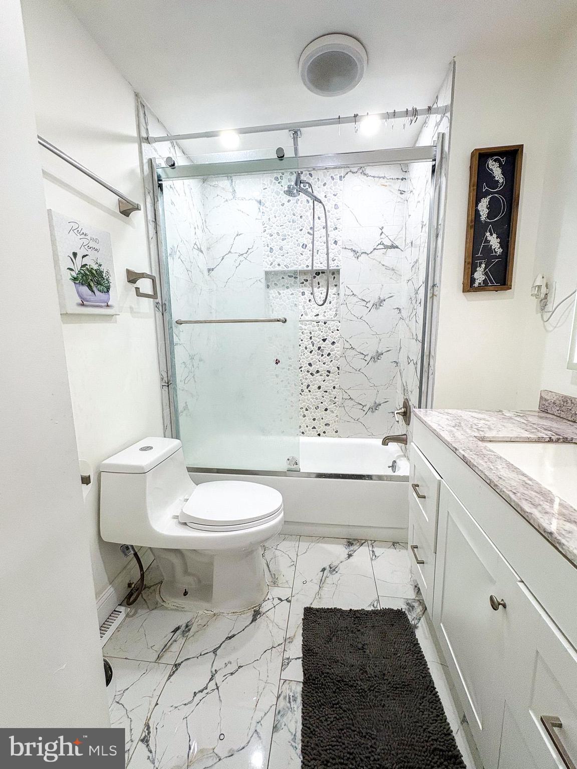 750 Miller Drive Dover, DE 19901 - Photo 15 of 49 a bathroom with a granite countertop toilet sink and shower