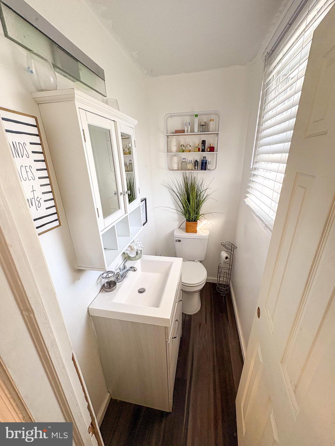 750 Miller Drive Dover, DE 19901 - Photo 26 of 49 a bathroom with a sink a toilet and a window
