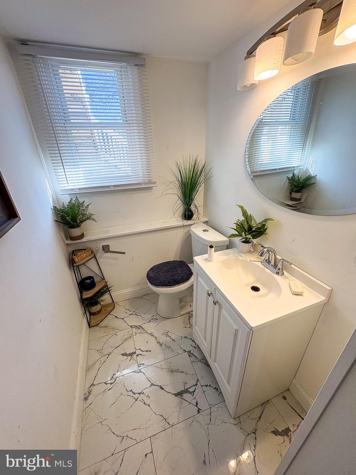 750 Miller Drive Dover, DE 19901 - Photo 43 of 49 a bathroom with a sink and mirror with bathtub