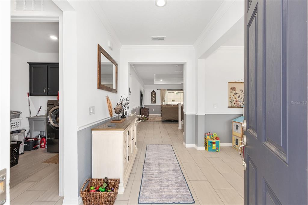 7208 Southwest 65th Place Road Ocala, FL 34474 - Photo 12 of 76 a living room with furniture and a wooden floor