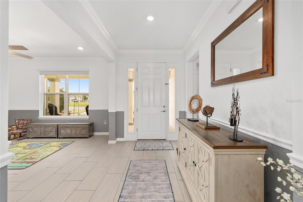 7208 Southwest 65th Place Road Ocala, FL 34474 - Photo 13 of 76 a spacious bathroom with a double vanity sink a mirror and a bathtub