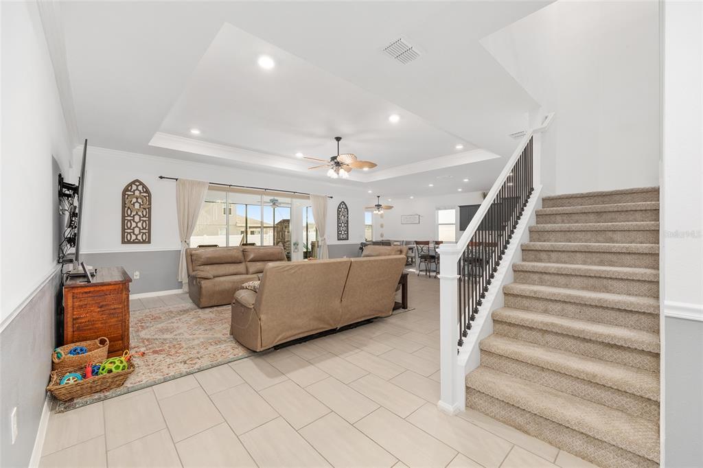 7208 Southwest 65th Place Road Ocala, FL 34474 - Photo 14 of 76 a living room with furniture and a flat screen tv