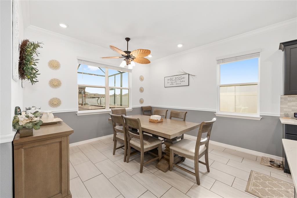 7208 Southwest 65th Place Road Ocala, FL 34474 - Photo 20 of 76 a view of a dining room with furniture and window