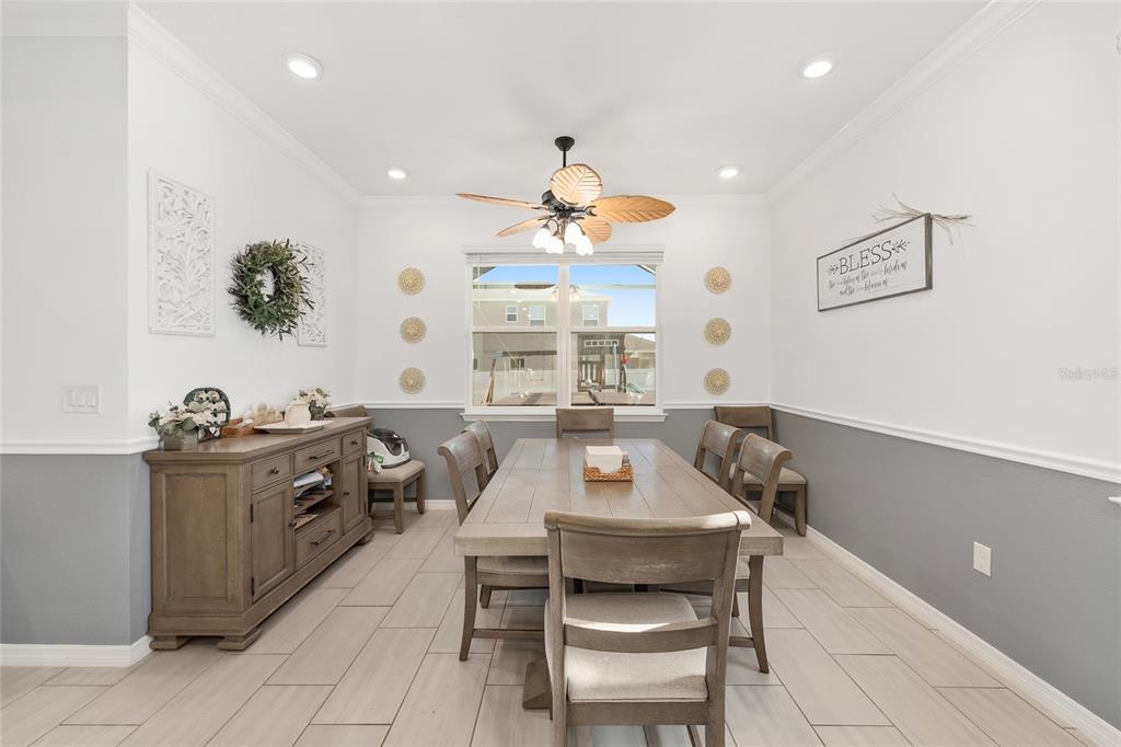7208 Southwest 65th Place Road Ocala, FL 34474 - Photo 21 of 76 a kitchen with a table and chairs in it