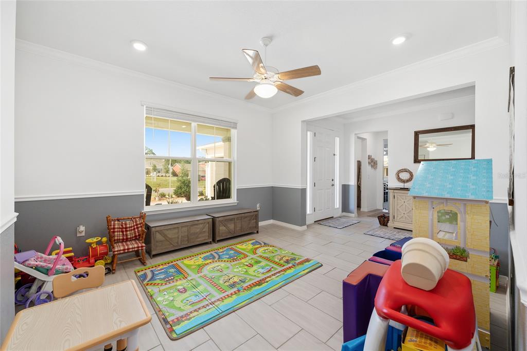 7208 Southwest 65th Place Road Ocala, FL 34474 - Photo 29 of 76 a living room with furniture and a window