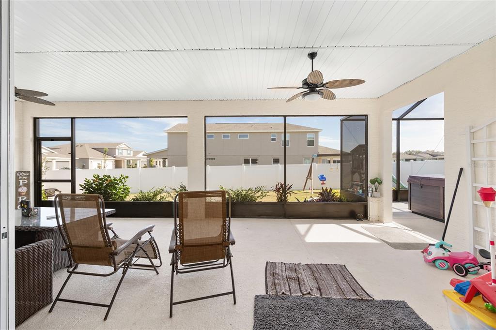 7208 Southwest 65th Place Road Ocala, FL 34474 - Photo 50 of 76 a living room with furniture and a chandelier