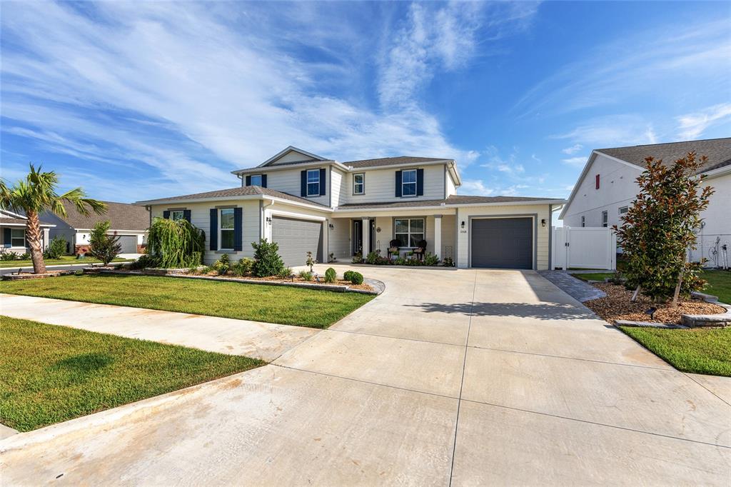 7208 Southwest 65th Place Road Ocala, FL 34474 - Photo 5 of 76 a front view of a house with a yard