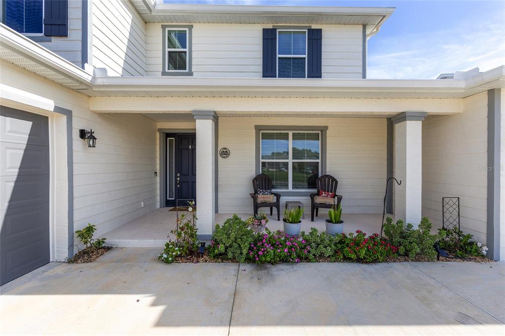 7208 Southwest 65th Place Road Ocala, FL 34474 - Photo 6 of 76 a front view of a house with a yard