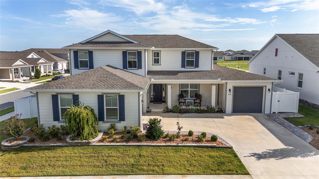 7208 Southwest 65th Place Road Ocala, FL 34474 - Photo 61 of 76 a front view of a house with garden