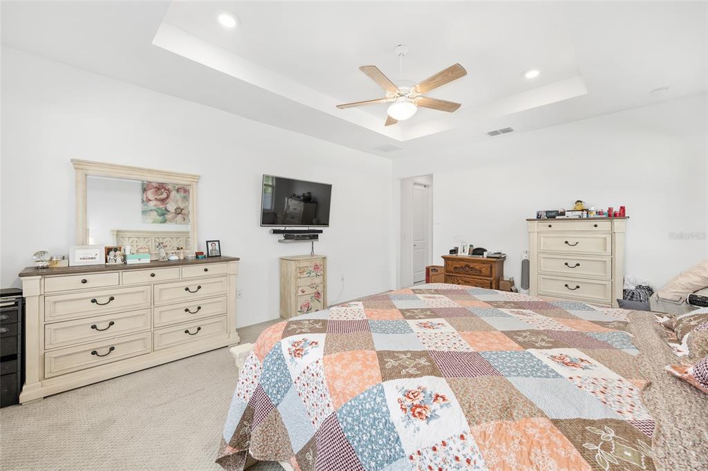 7208 Southwest 65th Place Road Ocala, FL 34474 - Photo 9 of 76 a bed room with a bed and a television