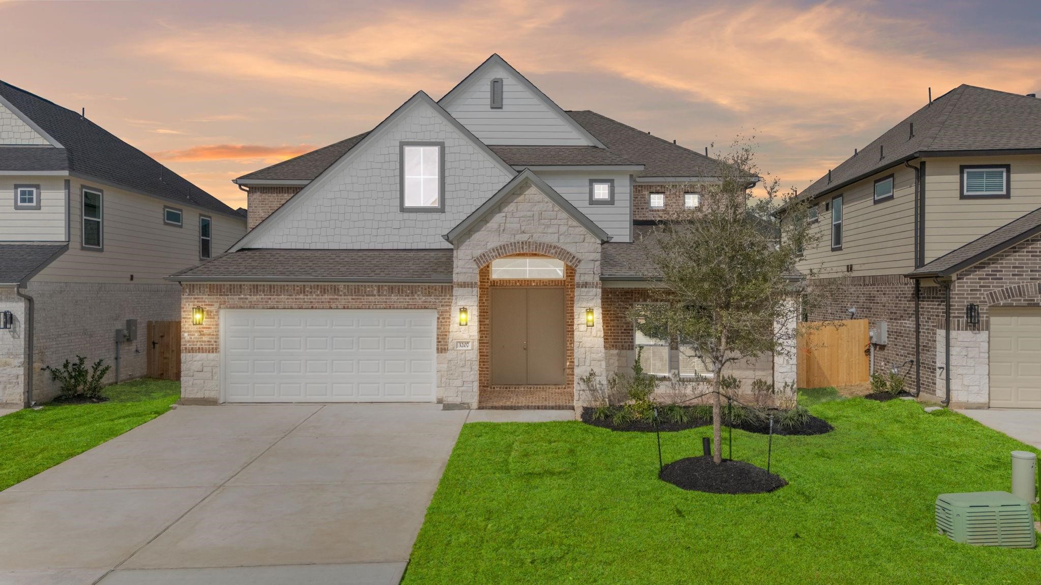 2136 Golden Spruce Court Conroe, TX 77301 - Photo 1 of 7 a front view of house with a garden and plants