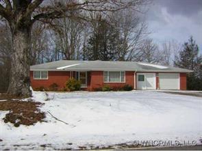 1339 North Ridge Road Hendersonville, NC 28792 - Photo 1 of 1 a front view of a house with a yard