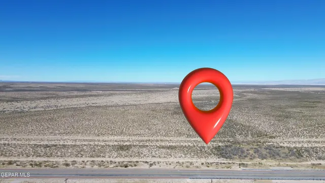 a view of a room with furniture and a fireplace