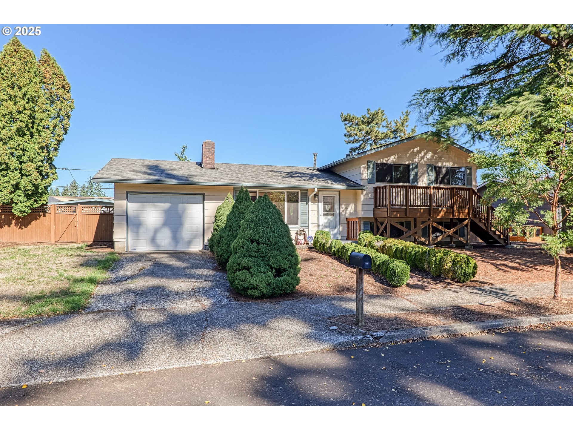 17909 Northeast Everett Court Portland, OR 97230 - Photo 1 of 25 a front view of a house with a yard and potted plants