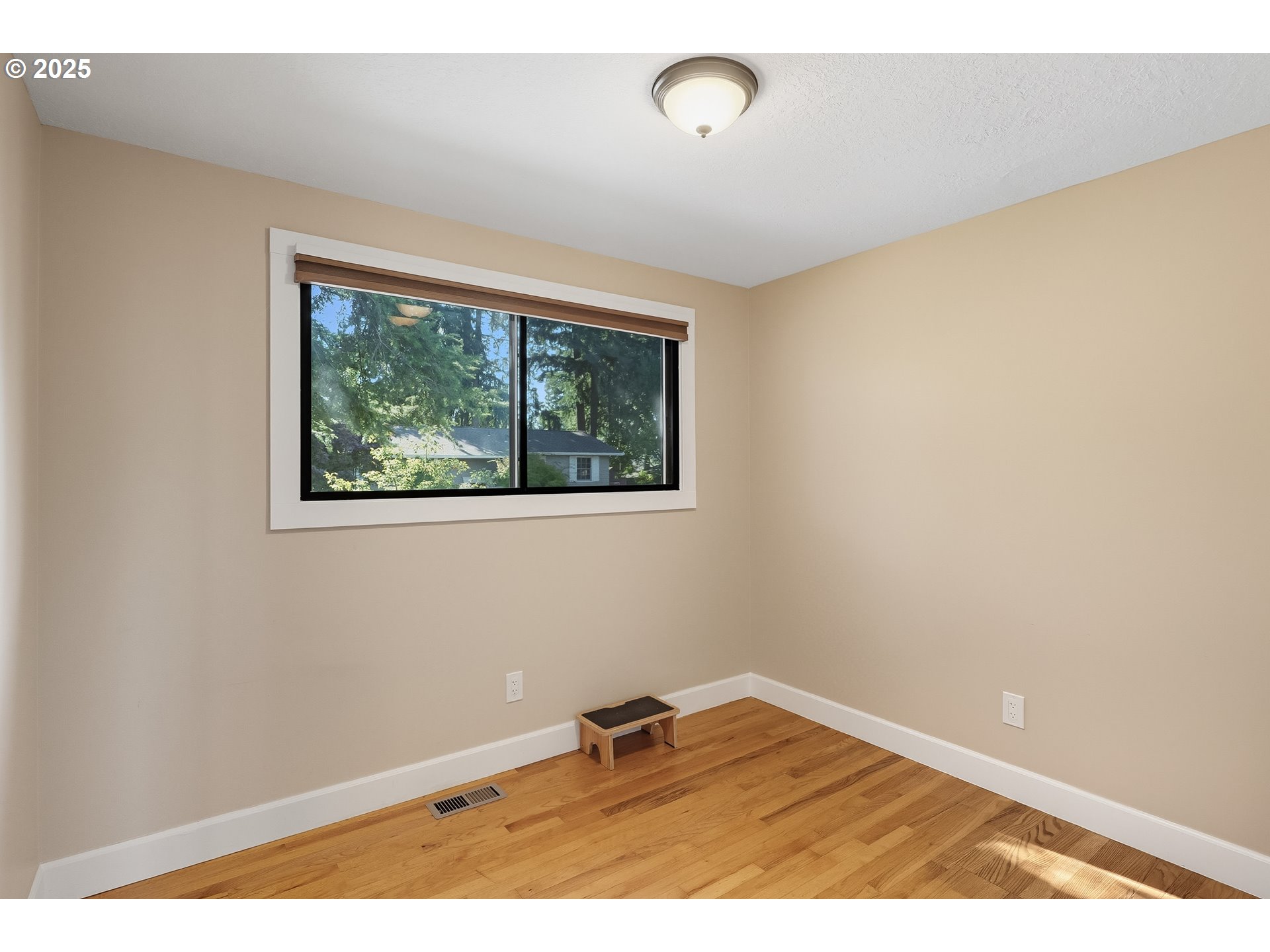 17909 Northeast Everett Court Portland, OR 97230 - Photo 14 of 25 a view of an empty room with wooden floor and a window