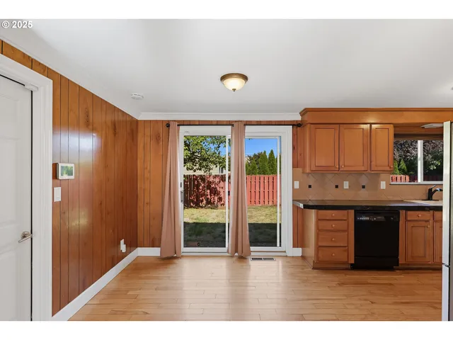 a kitchen with stainless steel appliances granite countertop a stove and a refrigerator