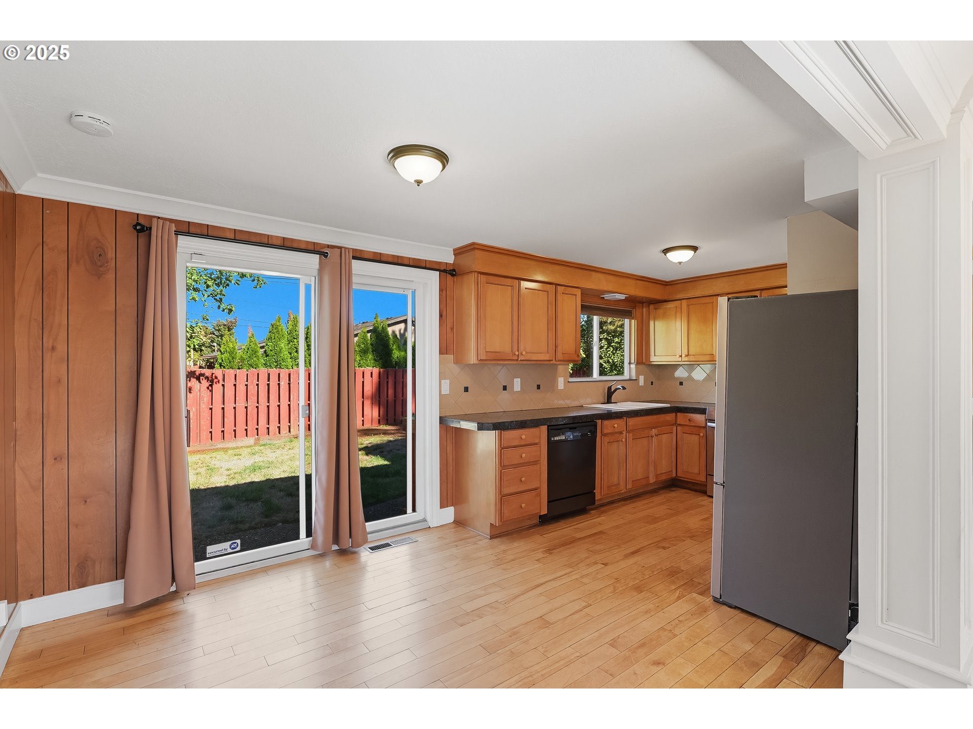 17909 Northeast Everett Court Portland, OR 97230 - Photo 7 of 25 a kitchen with stainless steel appliances granite countertop a refrigerator and a sink