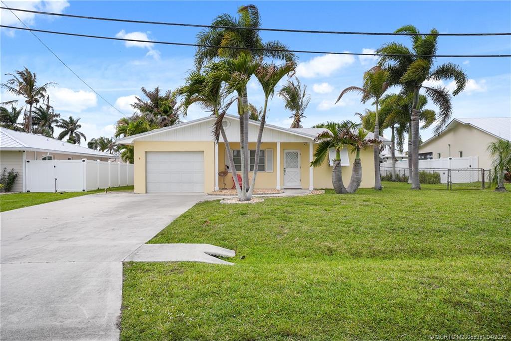 a view of a house with a backyard