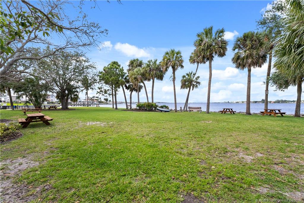 1459 Southwest Seahawk Way Palm City, FL 34990 - Photo 11 of 11 a view of yard with swimming pool and green space