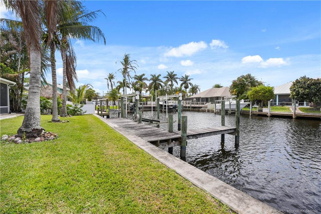 1459 Southwest Seahawk Way Palm City, FL 34990 - Photo 5 of 11 a view of a swimming pool with a lake view
