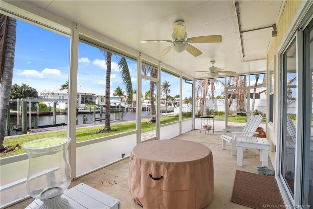 1459 Southwest Seahawk Way Palm City, FL 34990 - Photo 7 of 11 a swimming pool with chairs