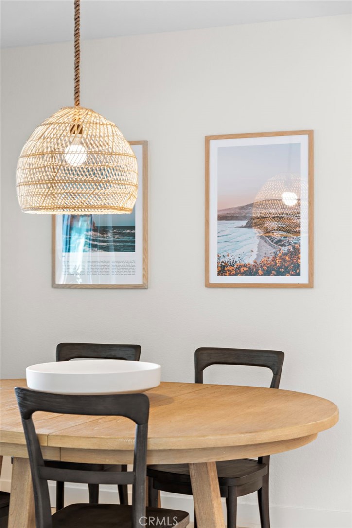 74 Corniche Drive, Unit D Dana Point, CA 92629 - Photo 21 of 22 a view of a dining room with furniture and chandelier